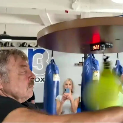 A boxer at R3 Boxing with the LED screen showing 328