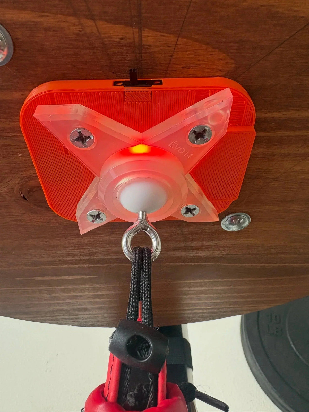 The Speedbag Champ counter screwed to the underside of a platform, with the EVO14 swivel mounted below it